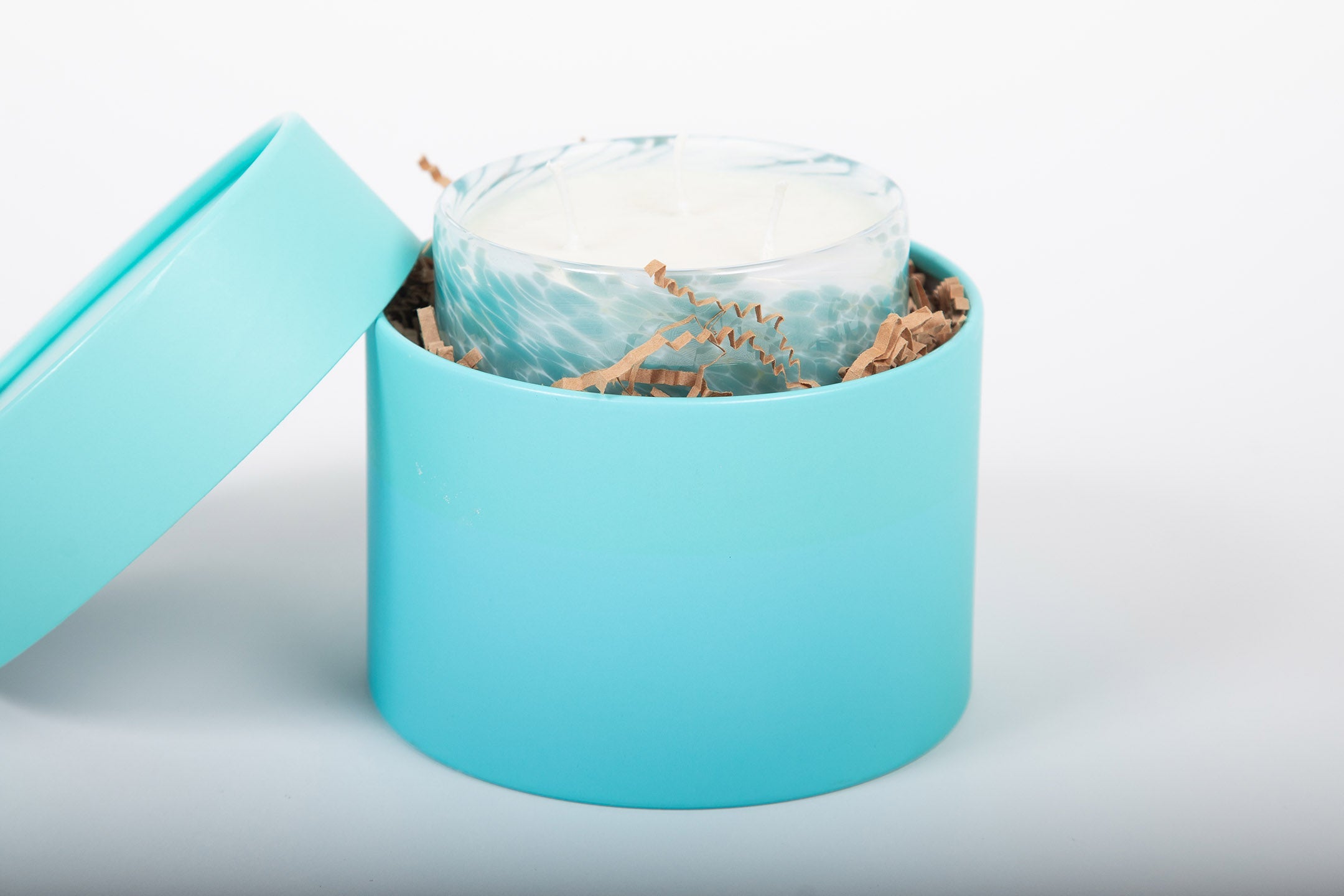 Peace Steel Turquoise & White Hand Blown Glass Candle from Life's About Change Light Collection
