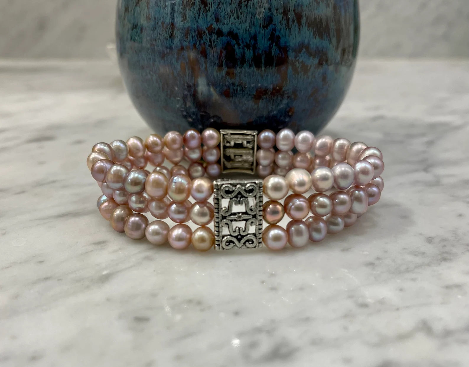 Pearl Stretch Bracelet with Metal Amulets